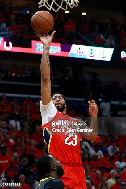 Anthony Davis of the New Orleans Pelicans shoot over Draymond Green during Game Four of the Western Conference Semifinals of the 2018 NBA Playoffs at...