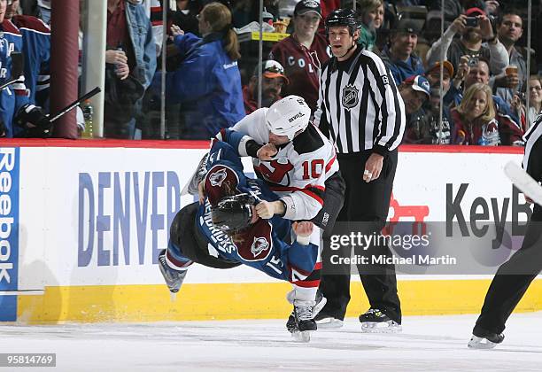 Matt Hendricks of the Colorado Avalanche is taken down by Rod Pelley of the New Jersey Devils at the Pepsi Center on January 16, 2010 in Denver,...