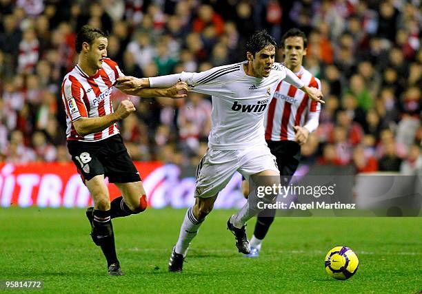 Kaka of Real Madrid competes for the ball with Carlos Gurpegi of Athletic Bilbao during the La Liga match between Athletic Bilbao and Real Madrid at...