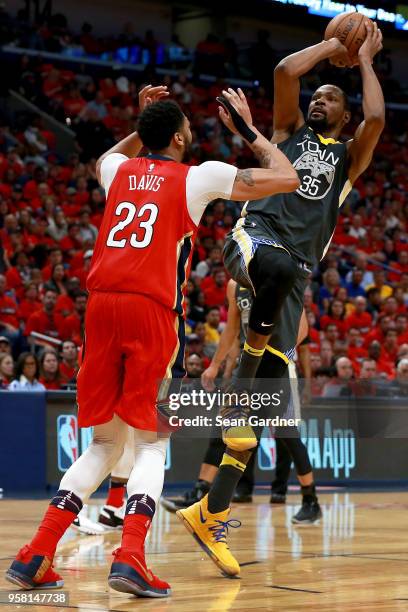 Kevin Durant of the Golden State Warriors shoots over Anthony Davis of the New Orleans Pelicans during Game Four of the Western Conference Semifinals...