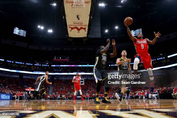 Rajon Rondo of the New Orleans Pelicans shoots over Draymond Green of the Golden State Warriors during Game Four of the Western Conference Semifinals...