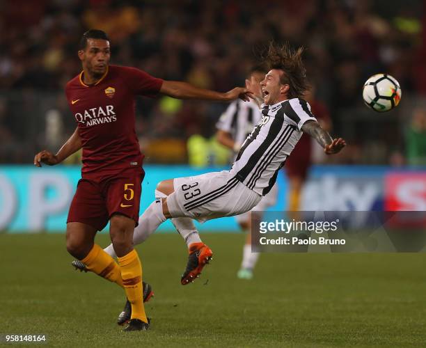 Juan Jesus of AS Roma competes for the ball with Federico Bernardeschi of Juventus during the Serie A match between AS Roma and Juventus at Stadio...