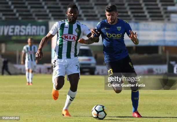 Vitoria Setubal forward Arnold Issoko from Congo with CD Tondela defender Joaozinho from Portugal in action during the Primeira Liga match between...