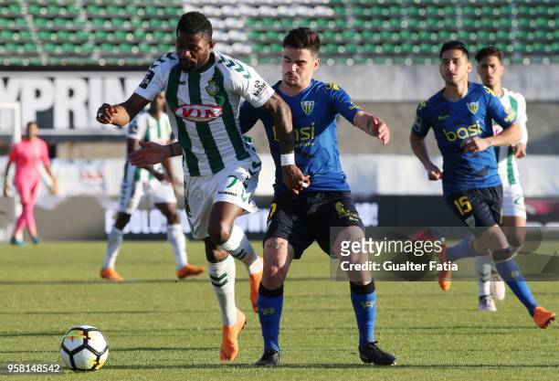Vitoria Setubal forward Arnold Issoko from Congo with CD Tondela midfielder Claude Goncalves from Portugal in action during the Primeira Liga match...