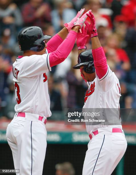 Jose Ramirez of the Cleveland Indians celebrates with Michael Brantley after hitting a three run home run off Starting pitcher Danny Duffy of the...