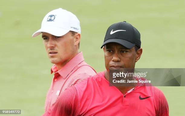 Tiger Woods of the United States and Jordan Spieth of the United States look on from the fourth hole during the final round of THE PLAYERS...