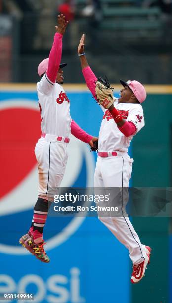 Francisco Lindor and Greg Allen of the Cleveland Indians celebrate an 11-2 victory over the Kansas City Royals at Progressive Field on May 13, 2018...