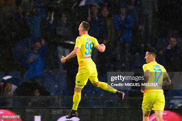 Napoli's forward from Poland Arkadiusz Milik celebrates after scoring during the Italian Serie A football match Sampdoria vs Napoli on May 13, 2018...