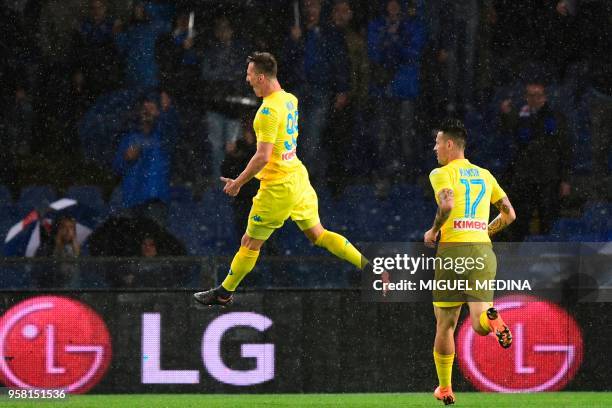 Napoli's forward from Poland Arkadiusz Milik celebrates after scoring during the Italian Serie A football match Sampdoria vs Napoli on May 13, 2018...