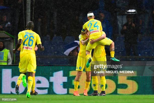 Napoli's forward from Poland Arkadiusz Milik celebrates with teammates after scoring during the Italian Serie A football match Sampdoria vs Napoli on...