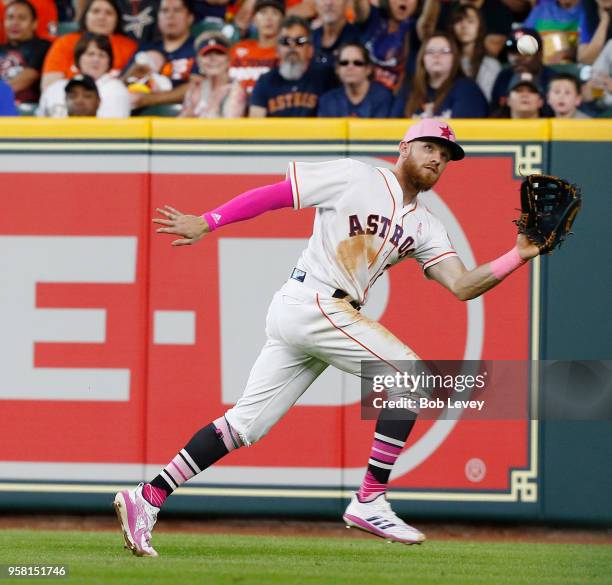 Derek Fisher of the Houston Astros makes a catch on a line drive by Delino DeShields of the Texas Rangers in the sixth inning at Minute Maid Park on...