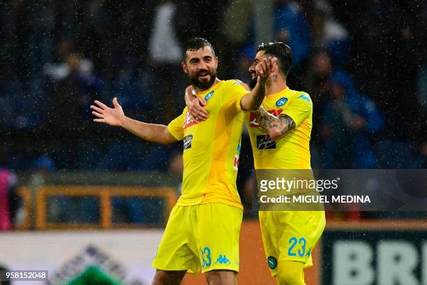 Napoli's defender from Spain Raul Albiol celebrates with teammate Napoli's defender from Albania Elseid Hysaj after scoring during the Italian Serie...