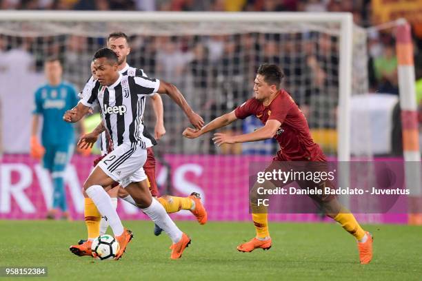 Alex Sandro of Juventus competes for the ball with Cengiz Under of AS Roma during the serie A match between AS Roma and Juventus at Stadio Olimpico...