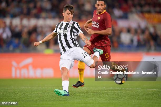 Paulo Dybala of Juventus competes for the ball with Nunes Juan Jesus of AS Roma during the serie A match between AS Roma and Juventus at Stadio...