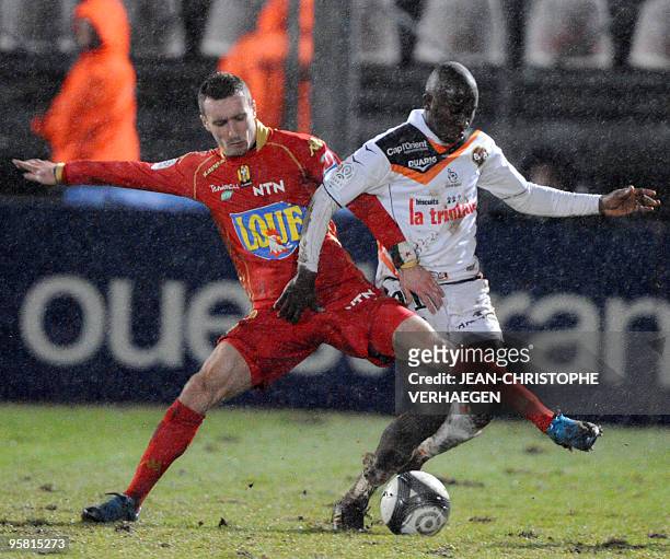 Le Mans' forward Idir Ouali vies with Malian Lorient's forward Sigamary Diarra during the French L1 football match at Marcel Picot Stadium, on...