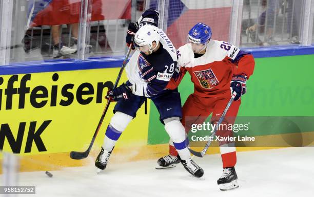 Michal Repik of Czech Republic in action with Yohann Auvitu of France during the 2018 IIHF Ice Hockey World Championship Group A between France and...