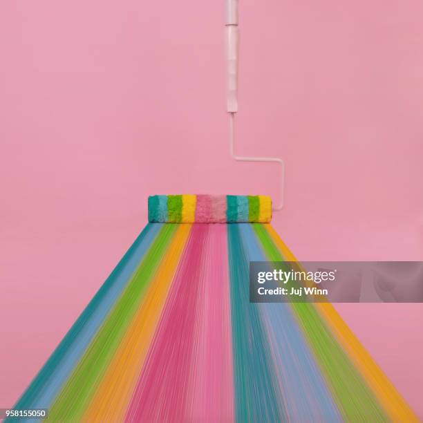 paint roller with rainbow stripes - rainbow color paint stock pictures, royalty-free photos & images