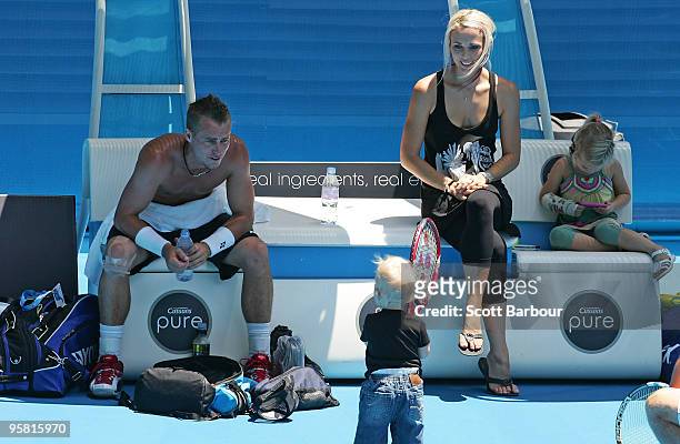 Australian actress Bec Cartwright and Lleyton Hewitt of Australia watch their son Cruz Hewitt and daughter Mia Hewitt during a practice session ahead...