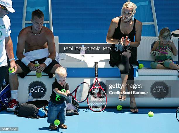 Australian actress Bec Cartwright and Lleyton Hewitt of Australia watch their son Cruz Hewitt and daughter Mia Hewitt during a practice session ahead...