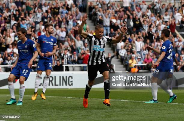 Dwight Gayle of Newcastle United celebrates after he score the opening goal during the Premier League match between Newcastle United and Chelsea at...