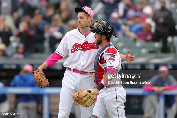 Cleveland Indians pitcher Andrew Miller and Cleveland Indians catcher Yan Gomes celebrate following the Major League Baseball game between the Kansas...