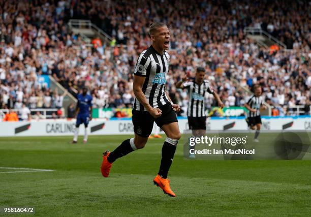 Dwight Gayle of Newcastle United celebrates after he score the opening goal during the Premier League match between Newcastle United and Chelsea at...