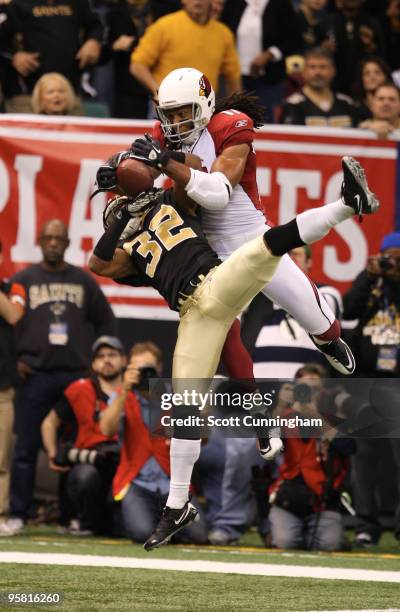 Jabari Greer of the New Orleans Saints defends a pass against Larry Fitzgerald of the Arizona Cardinals in an NFC Divisional Playoff Game at the...