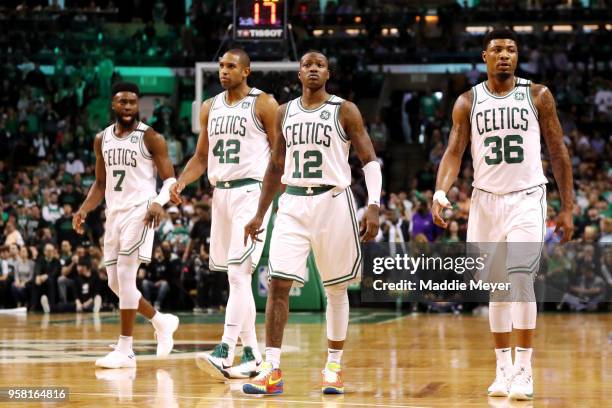 Jaylen Brown, Al Horford, Terry Rozier and Marcus Smart of the Boston Celtics walk back on the court after a timeout against the Cleveland Cavaliers...