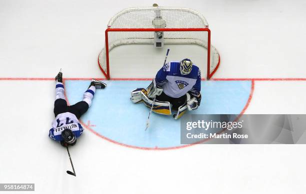Markus Nutivaara of Finland and team mate Ville Husso look dejected after the 2018 IIHF Ice Hockey World Championship Group B game between Germany...