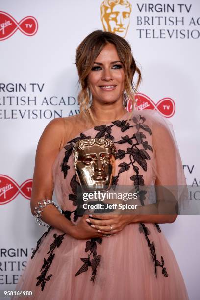 Caroline Flack poses with the award for Best Reality and Constructed Factual Series for 'Love Island' in the press room at the Virgin TV British...