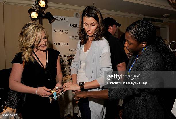 Actress Jane Krakowski and actress Bridget Moynahan visit the Invicta Watch Group suite during the HBO Luxury Lounge in honor of the 67th annual...