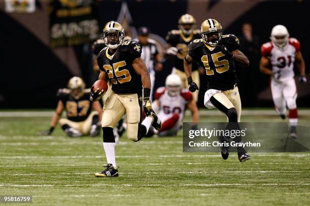 Reggie Bush of the New Orleans Saints scores on a 83-yard punt return for a touchdown in the third quarter against the Arizona Cardinals during the...