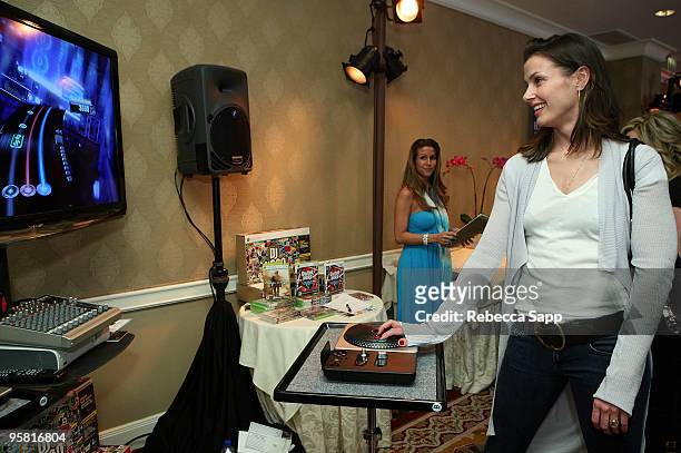 Actress Bridget Moynahan visits the Activision display during the HBO Luxury Lounge in honor of the 67th annual Golden Globe Awards held at the Four...