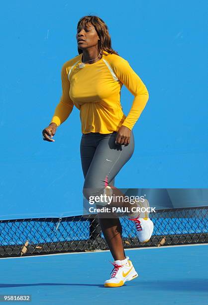 Tennis player Serena Williams jogs during a training session ahead of the Australian Open tennis tournament in Melbourne on January 17, 2010....