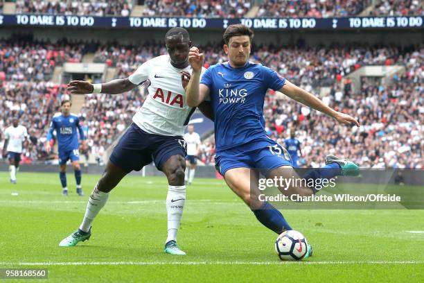 Moussa Sissoko of Tottenham and Harry Maguire of Leicester battle for the ball during the Premier League match between Tottenham Hotspur and...