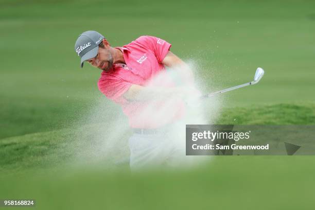 Webb Simpson of the United States plays his second shot on the fourth hole during the final round of THE PLAYERS Championship on the Stadium Course...