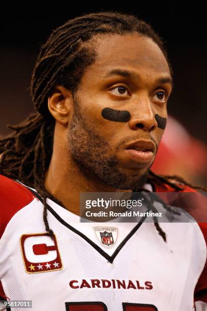 Larry Fitzgerald of the Arizona Cardinals looks on dejected as he stands on the sideline against the New Orleans Saints during the NFC Divisional...