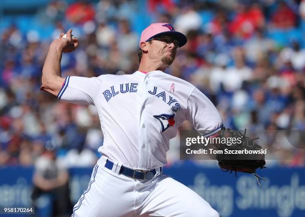 Tyler Clippard of the Toronto Blue Jays delivers a pitch in the ninth inning during MLB game action against the Boston Red Sox at Rogers Centre on...