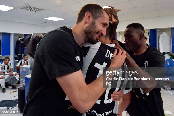 Giorgio Chiellini, Paulo Dybala and Kwadwo Asamoah of Juventus celebrate the seventh league titles in a row after the serie A match between AS Roma...