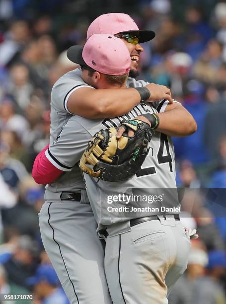 Jose Abreu of the Chicago White Sox hugs teammate Matt Davidson after a win against the Chicago Cubs at Wrigley Field on May 13, 2018 in Chicago,...