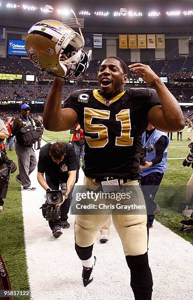 Jonathan Vilma of the New Orleans Saints celebrates as he walks off the field after their 45-14 win against the Arizona Cardinals during the NFC...
