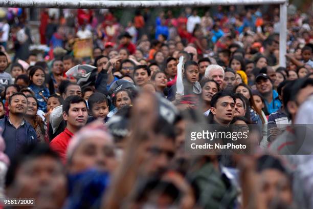 Nepalese people observing as Members of Guthi Sansthan displaying the bejeweled vest known as Bhoto to the public from the chariot on celebration of...
