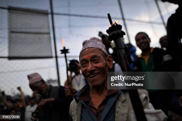 An old man arrive to offer oil lamp during Bhoto Jatra festival at Jawalakhel, Patan, Nepal on Monday, May 14, 2018. Rato Machindranath is also said...