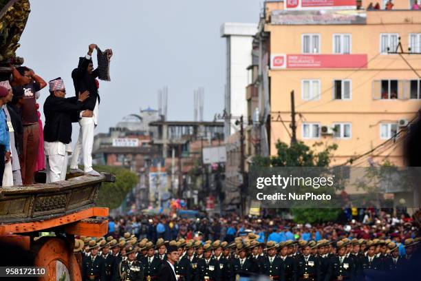 Members of Guthi Sansthan displaying the bejeweled vest known as Bhoto to the public from the chariot on celebration of Bhoto Jatra festival at...