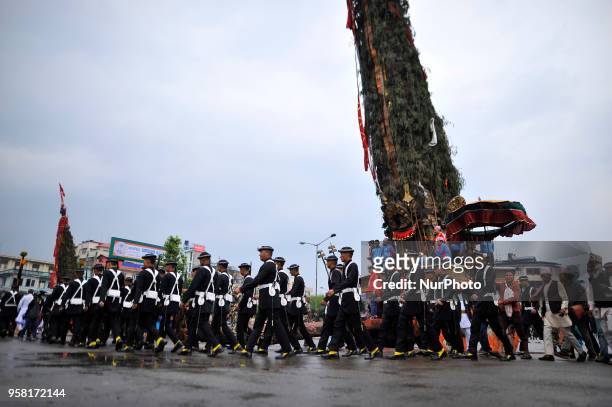 Members of Gurju Paltan Army personnel rotating Chariot by playing traditional musical instruments on celebration of Bhoto Jatra festival at...