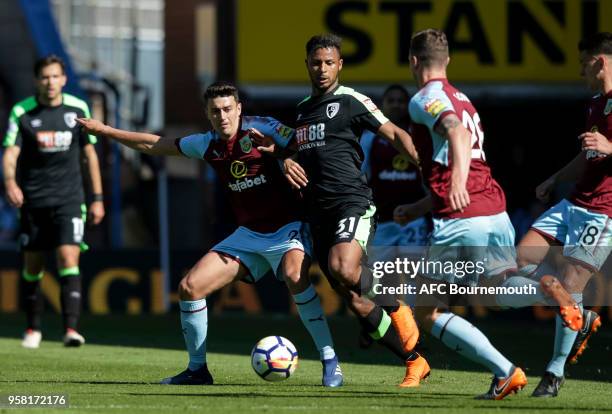 Matthew Lowton of Burnley FC with Lys Mousset of Bournemouth during the Premier League match between Burnley and AFC Bournemouth at Turf Moor on May...