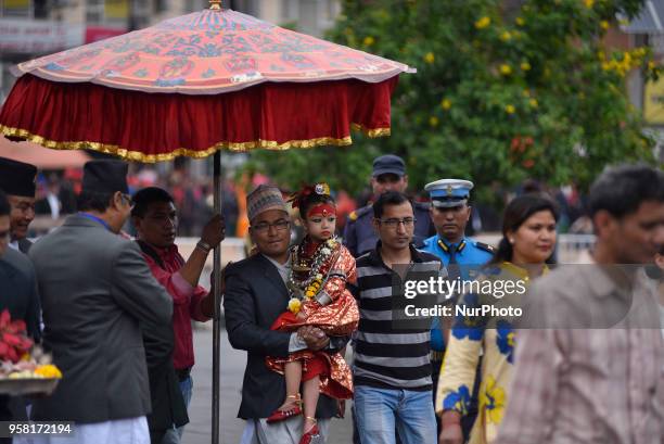 Yrs old Living goddess of Patan, Nihira Bajracharya arrives to observe the displaying bejeweled vest known as Bhoto to the public from the chariot on...