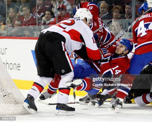 Mike Fisher of the Ottawa Senators shoves Tomas Plekanec of the Montreal Canadiens during the NHL game on January 16, 2010 at the Bell Centre in...