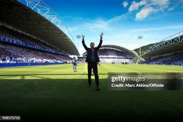 Arsene Wenger manager of Arsenal salutes the fans before his last game in charge during the Premier League match between Huddersfield Town and...