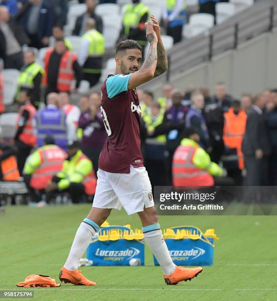 Manuel Lanzini of West Ham United applauds the fans as he is substituted during the Premier League match between West Ham United and Everton at...